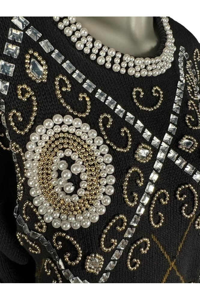 close up of 1980s vintage beaded sweater dress
